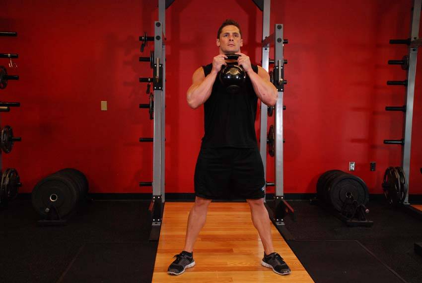 Starting position for a goblet squat
